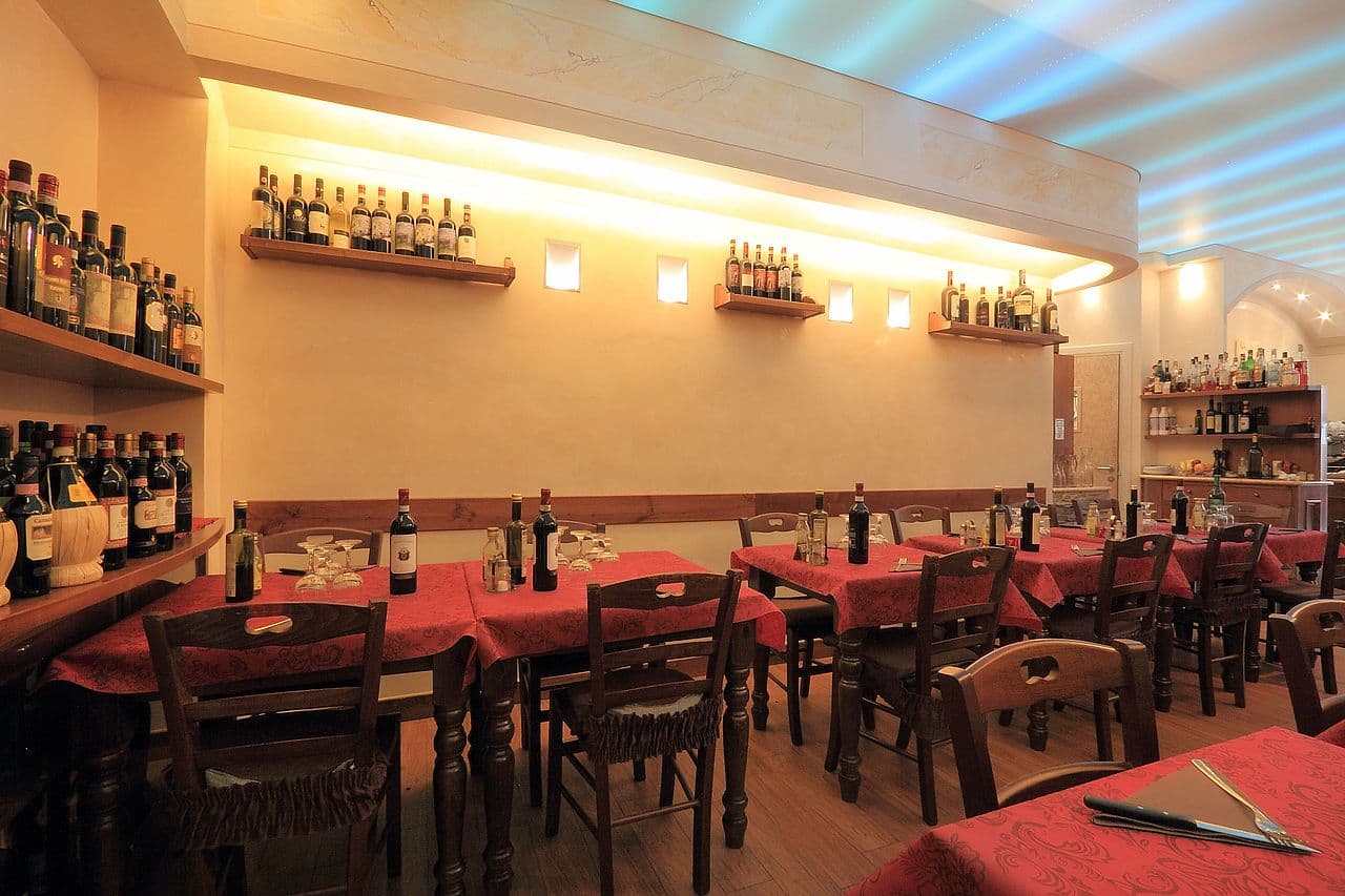 Tables set for service at Trattoria Katti